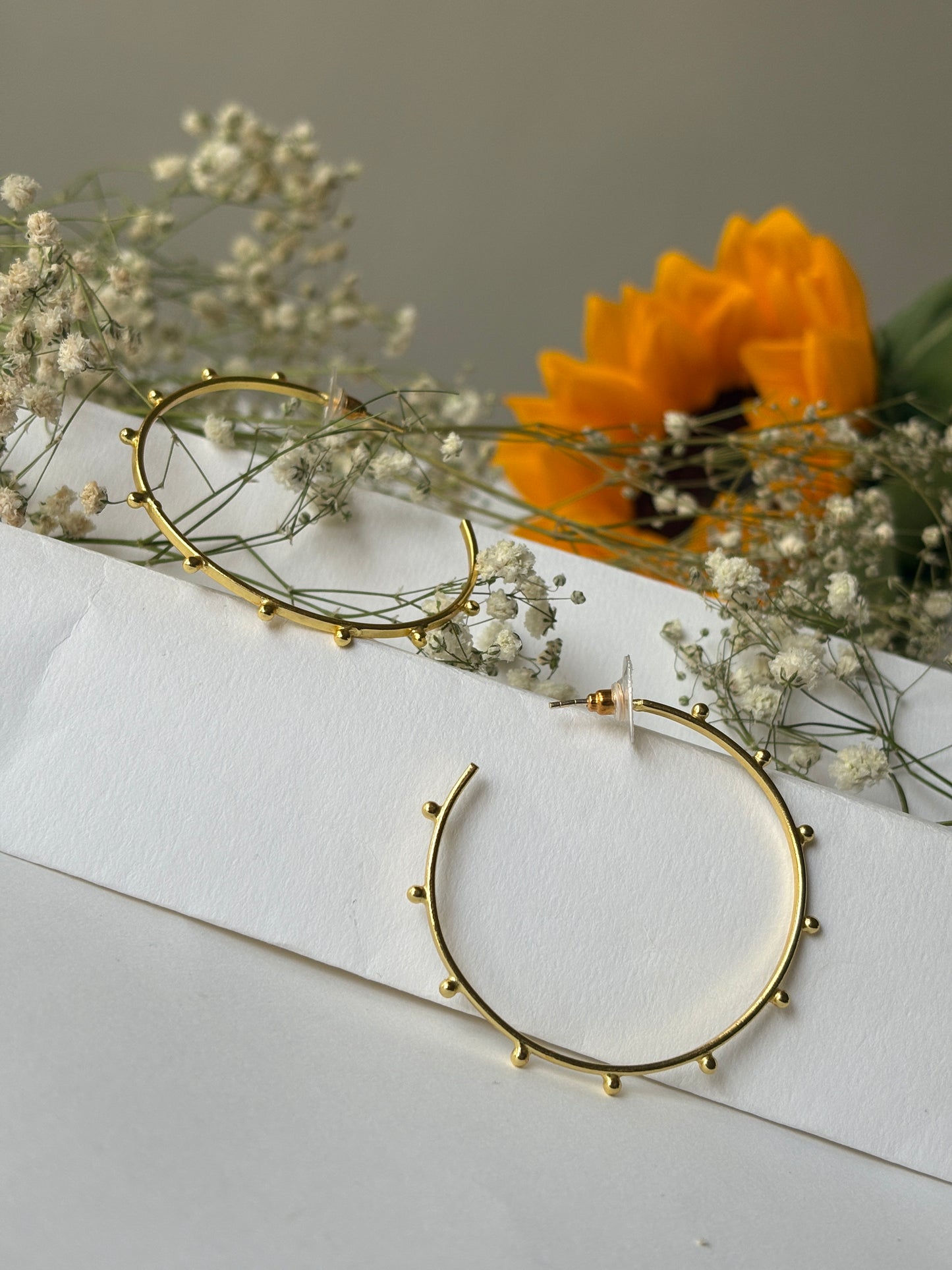 Doted golden hoops