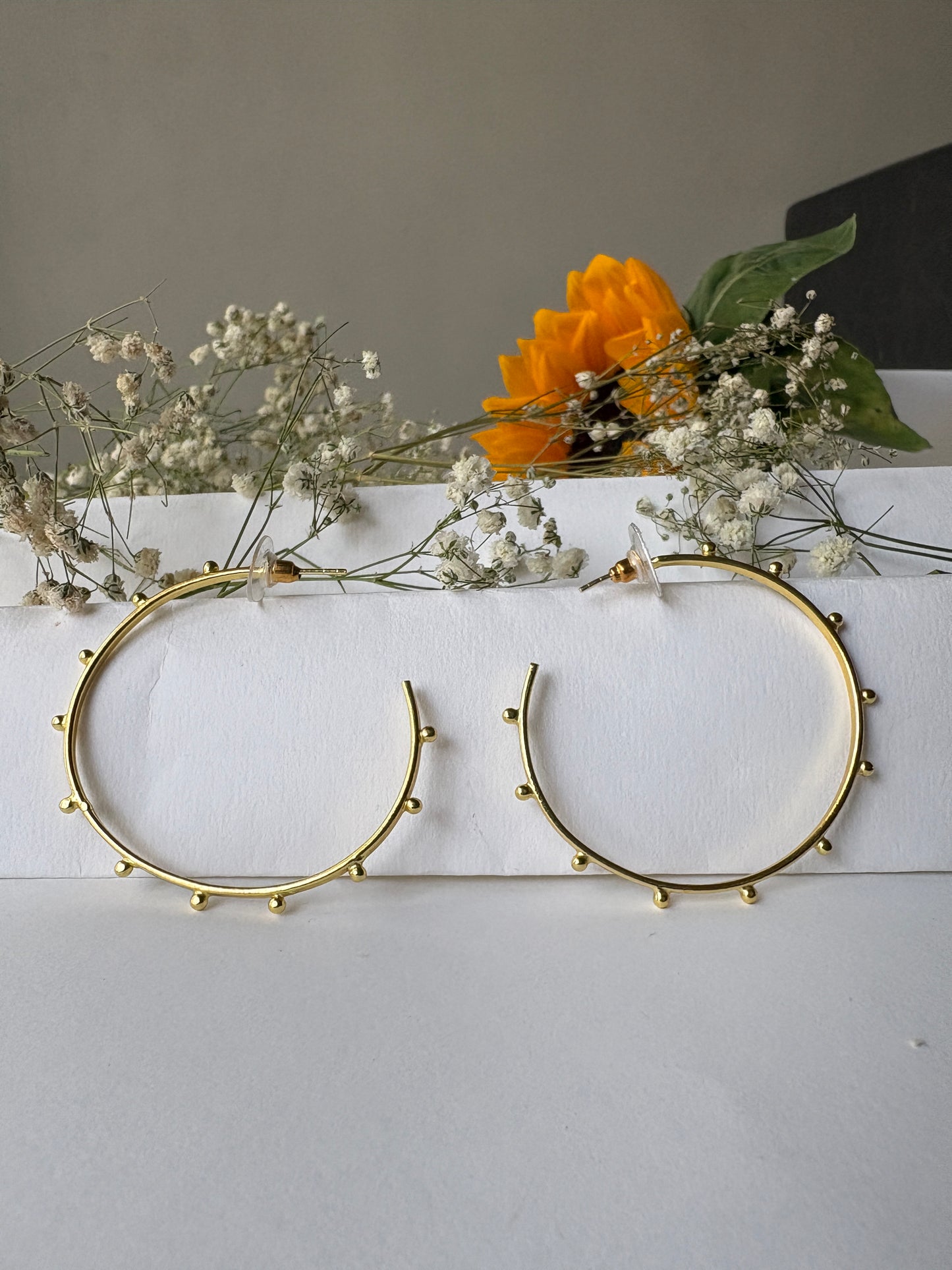 Doted golden hoops