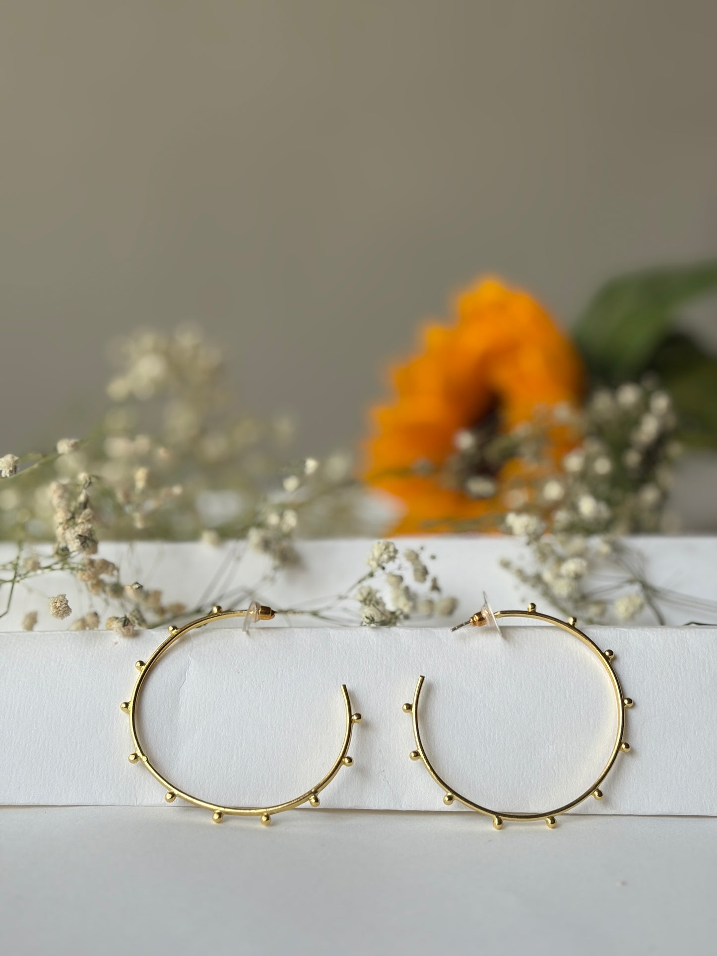 Doted golden hoops